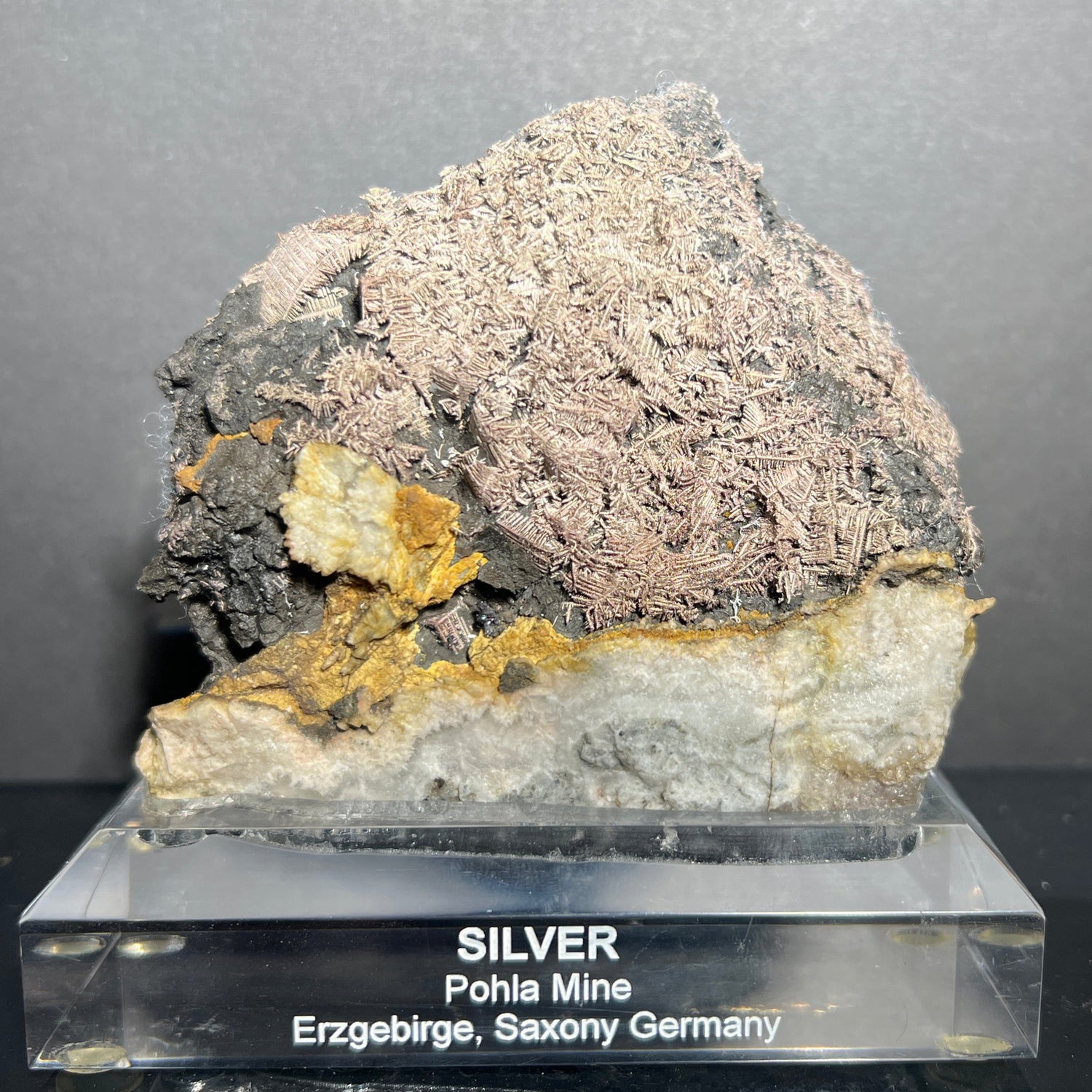 Fern-like native silver crystals on native arsenic from Saxony, Germany